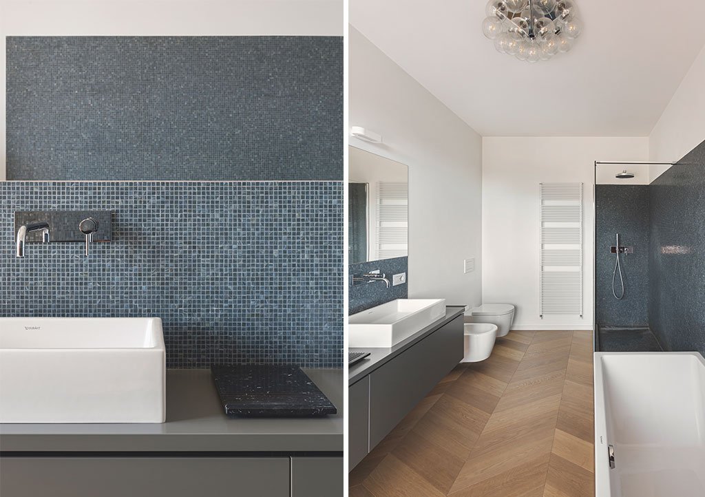 bagno con lavabo appoggio vasca e sanitari sospesi