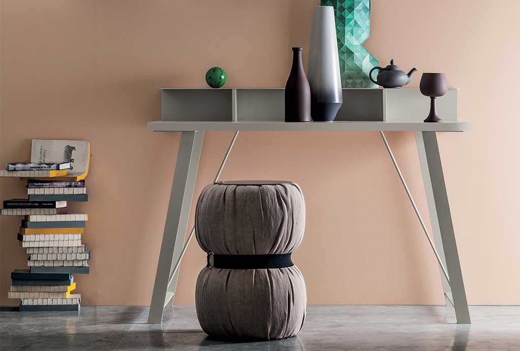 desk with oblique metal legs and top with compartments