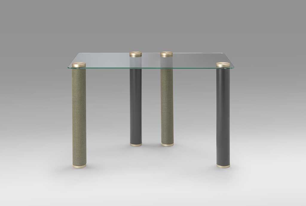 desk with glass top and wooden legs covered in fabric