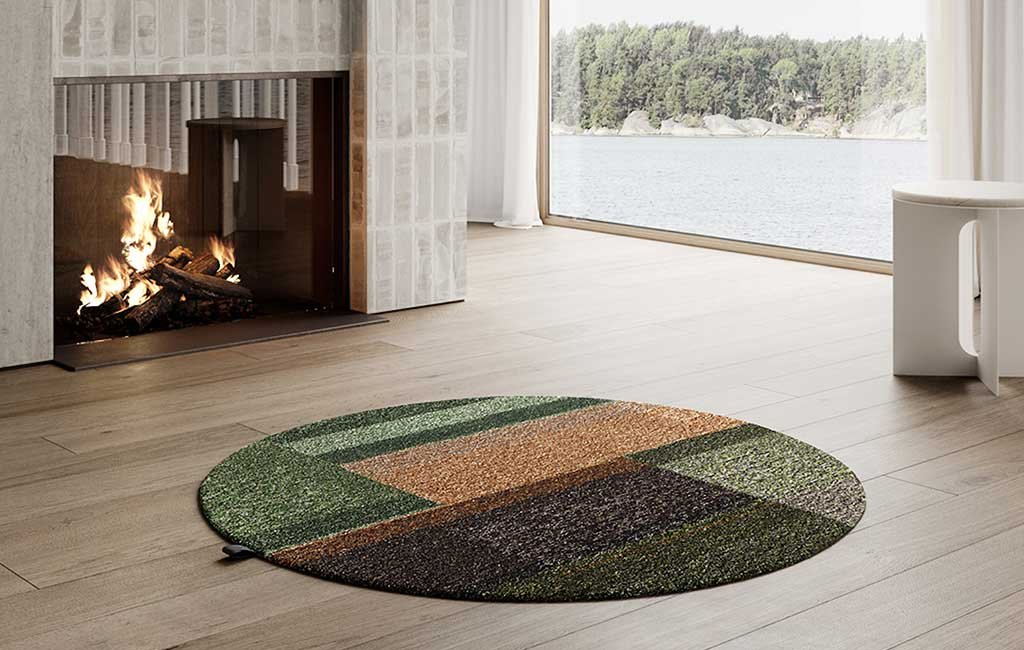 tappeto rotondo colori verde tonalita fatto con filati riciclo