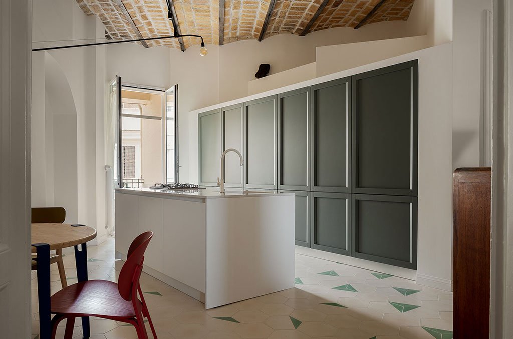 kitchen area with island and wall cabinets