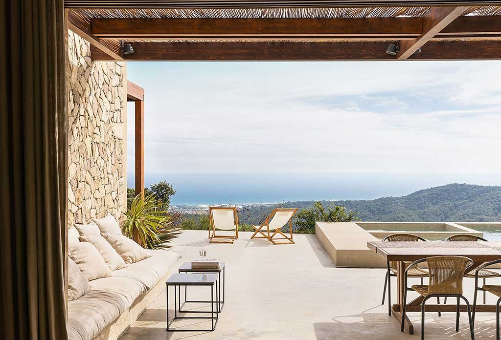 porch overlooking swimming pool calm house