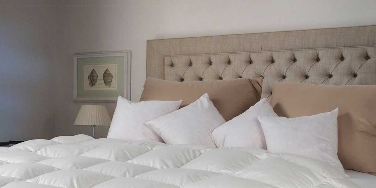 letto-matrimoniale-trapunta-e-cuscini
